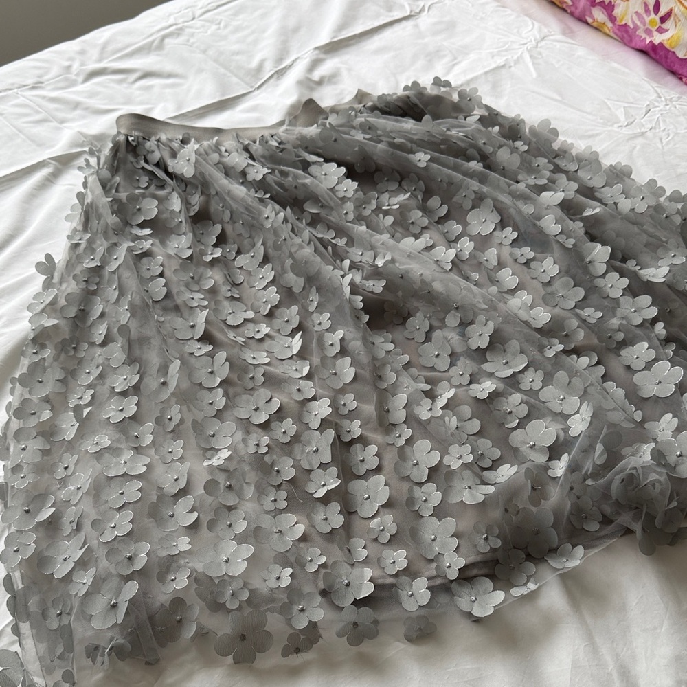 Fun and flirty skirt with embellished floral design